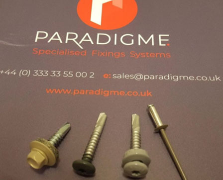 Spray coated fixings
